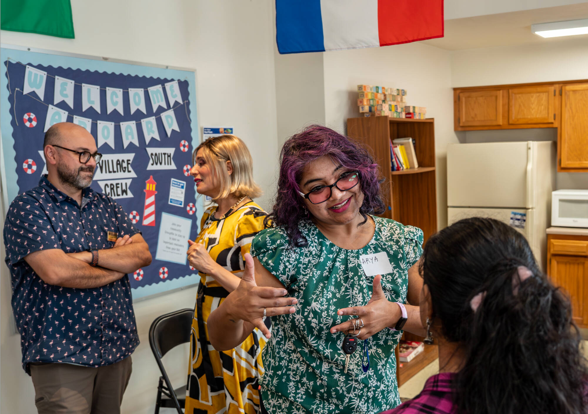 College of Computing members chatting during an event